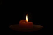 closeup-shot-of-a-burning-candle-in-the-dark-scaled-1